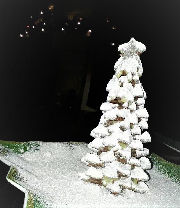 A gingerbread Christmas tree on a plate.